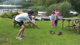 Freddie feeds the ducks while we wait to board our rowing boats at Faeryland, Grasmere